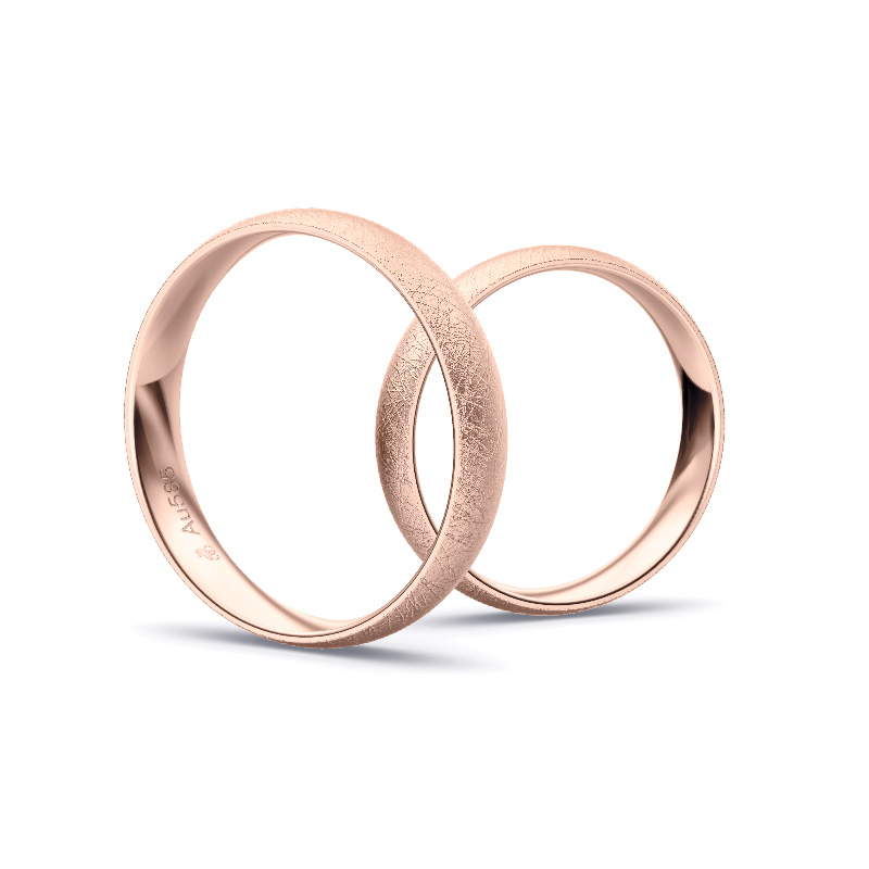 Aufnahme von schlichten eismatten Trauringen aus Rosegold mit Diamant mit 4 mm Breite 