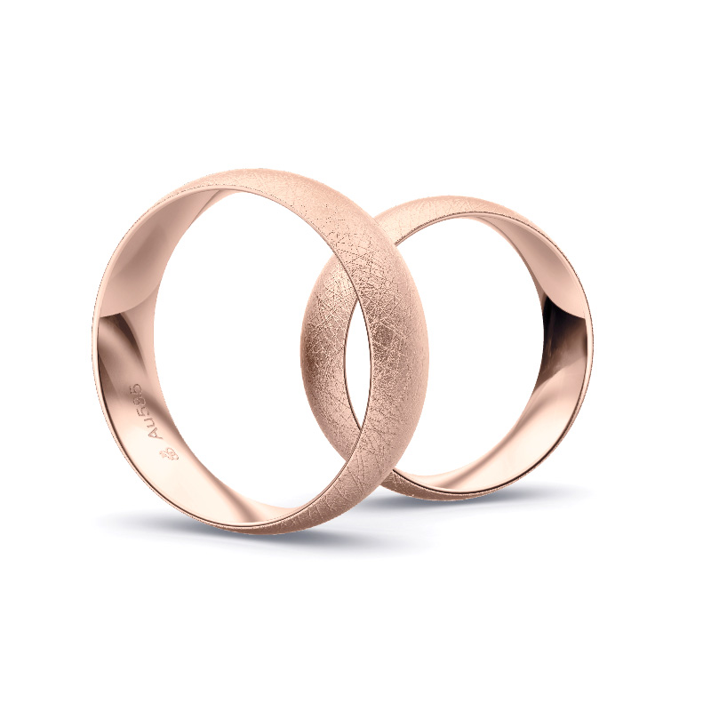 Aufnahme von schlichten eismatten Trauringen aus Roségold mit Diamant mit 6 mm Breite