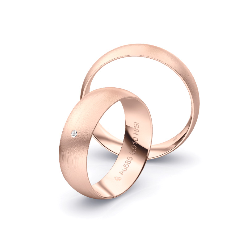 Aufnahme von schlichten matten Trauringen aus Rosegold mit Diamanten mit 6 mm Breite