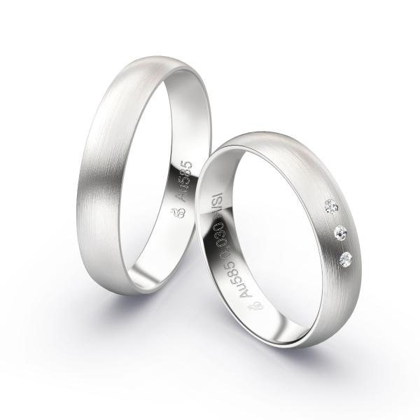 Aufnahme von längsmatten Weißgold Eheringen mit 3 Diamanten in 4 mm Breite