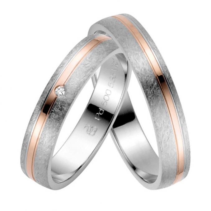 Aufnahme von Eheringen aus Roségold&Palladium500 schmal mit rundem Diamanten und seitigem Streifen