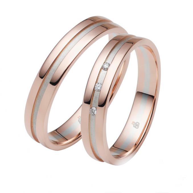 Aufnahme von bicoloren Eheringe aus Roségold & Palladium 500 mit Diamanten