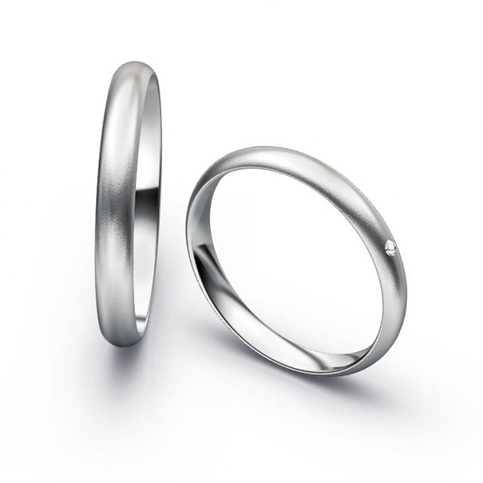 Aufnahme von schlichten sandmatten Trauringen aus Palladium 500 mit Diamant mit 3 mm Breite