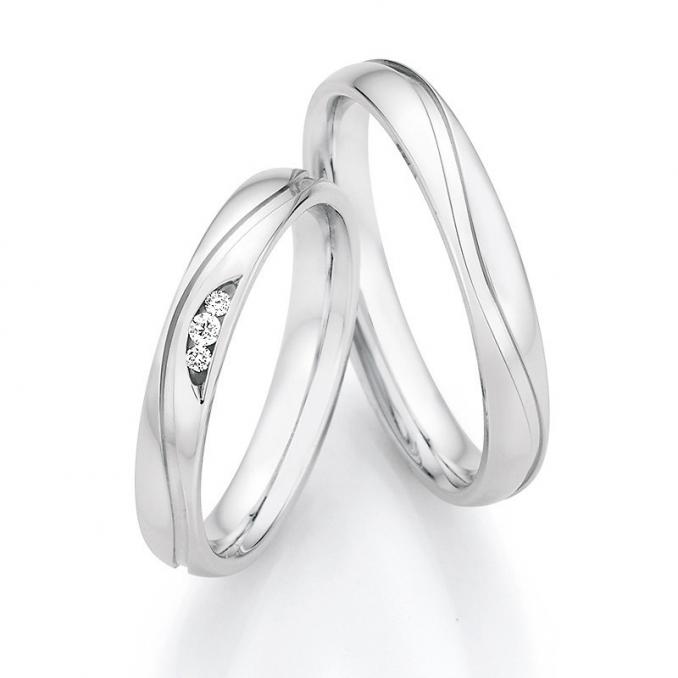 Eheringe aus925er Silber mit drei Diamanten und welliger Rille